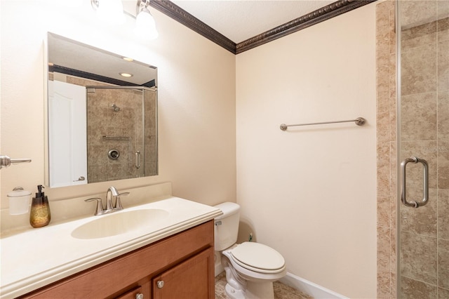 bathroom featuring vanity, toilet, a shower with shower door, and ornamental molding