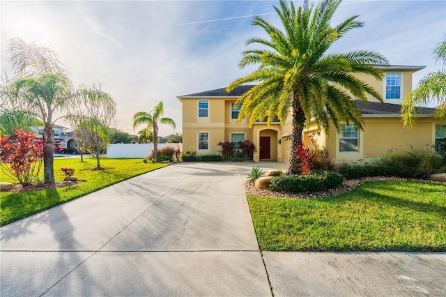 mediterranean / spanish-style home with a front yard