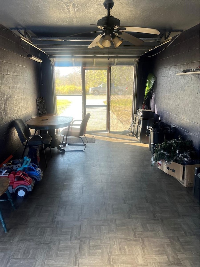 interior space featuring ceiling fan