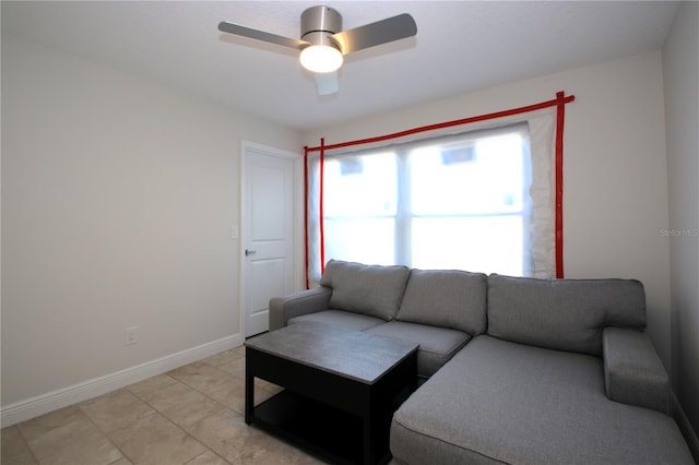 tiled living room with ceiling fan