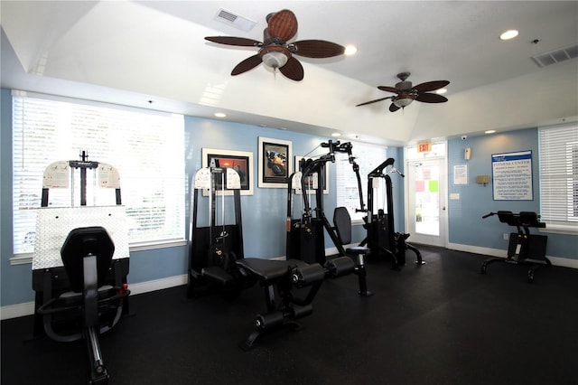 gym featuring ceiling fan and vaulted ceiling