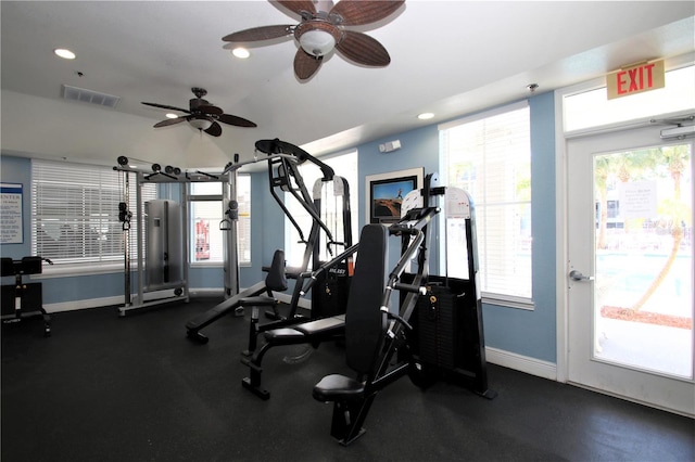 exercise room with plenty of natural light and ceiling fan