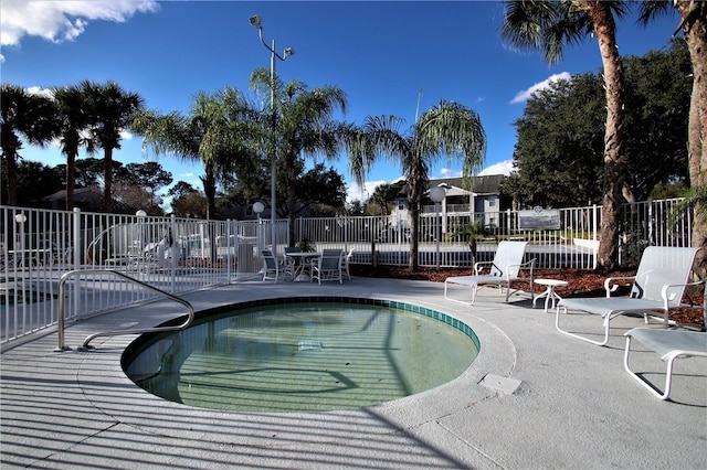 view of swimming pool featuring a patio area