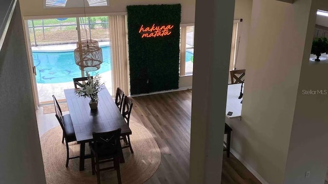 dining area with dark hardwood / wood-style floors