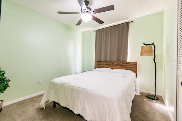 bedroom featuring a ceiling fan, baseboards, and carpet flooring