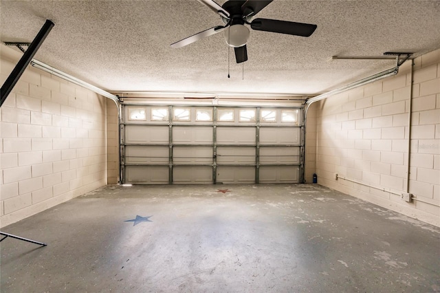 garage with concrete block wall