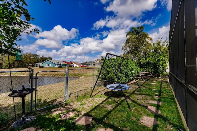 view of yard featuring a gate and fence