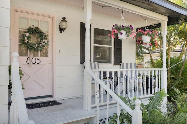 property entrance featuring covered porch