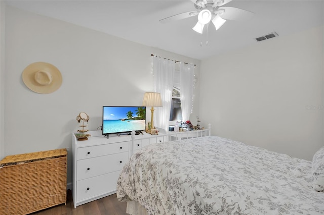 bedroom featuring ceiling fan and dark wood-type flooring