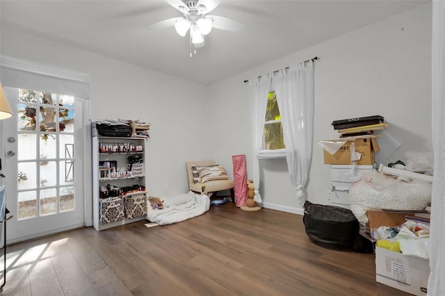 miscellaneous room with ceiling fan and wood-type flooring