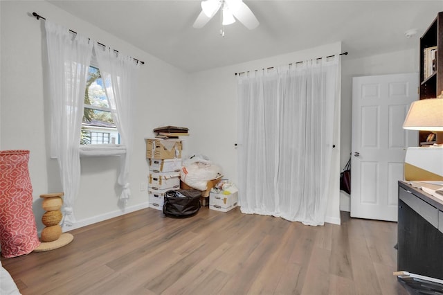 miscellaneous room with hardwood / wood-style flooring and ceiling fan