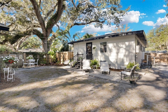 rear view of property with a patio