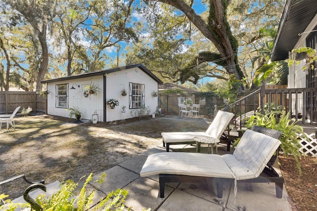 view of patio / terrace featuring an outbuilding