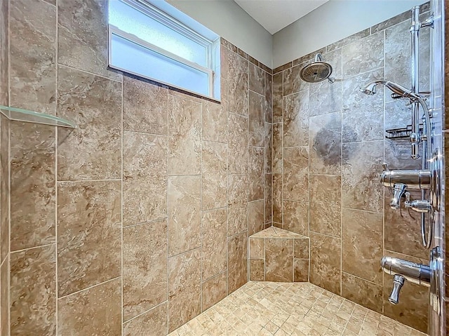 bathroom with tiled shower