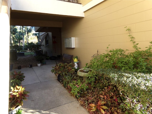 view of side of home with a patio area