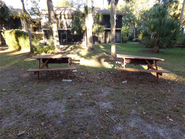 view of property's community featuring a yard