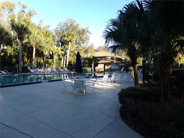 exterior space featuring a patio area and a pool