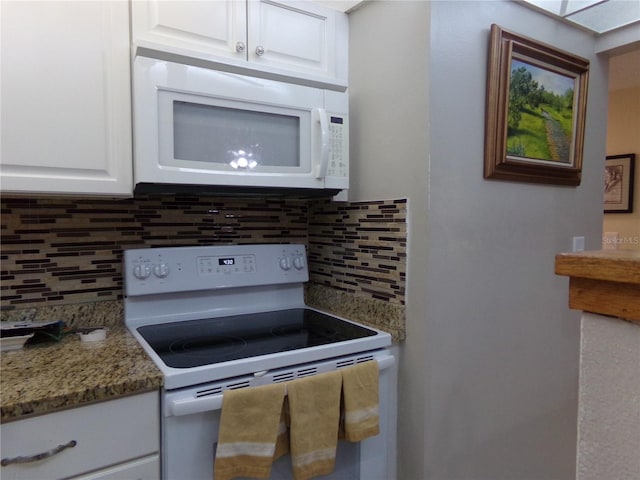 kitchen featuring white cabinets, white appliances, backsplash, and stone counters