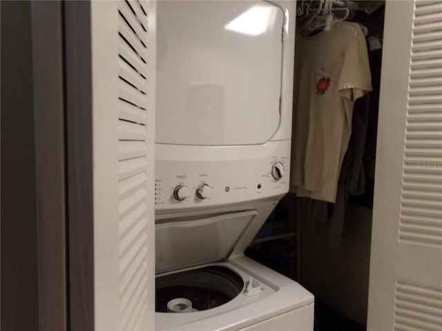 laundry room with stacked washer and clothes dryer