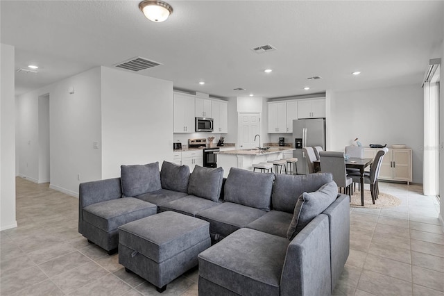 living room with light tile patterned flooring