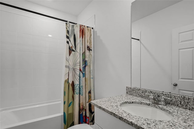 full bathroom featuring shower / bath combo, vanity, and toilet