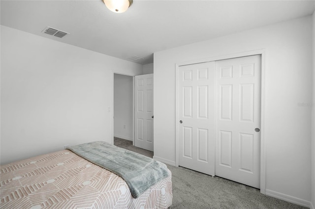 carpeted bedroom with a closet