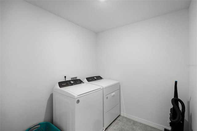 laundry area featuring washing machine and clothes dryer