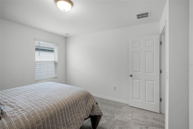 bedroom with light carpet