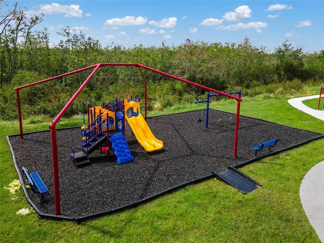 view of playground featuring a lawn