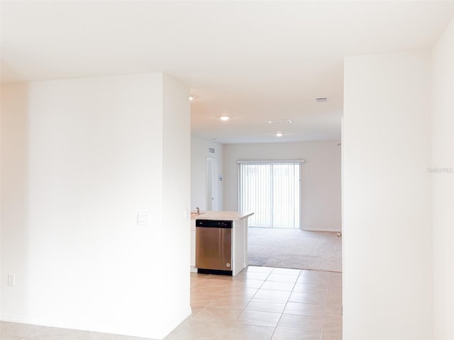 hallway with light tile patterned floors