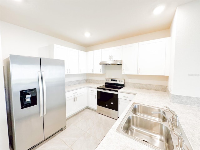 kitchen featuring white cabinets, sink, light tile patterned floors, and stainless steel appliances