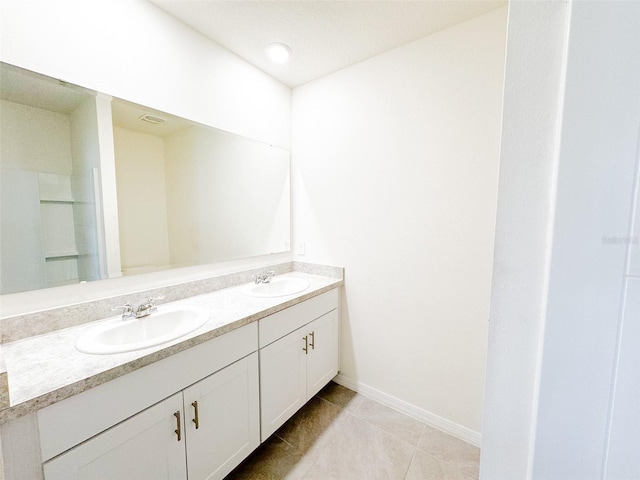 bathroom with tile patterned flooring and vanity