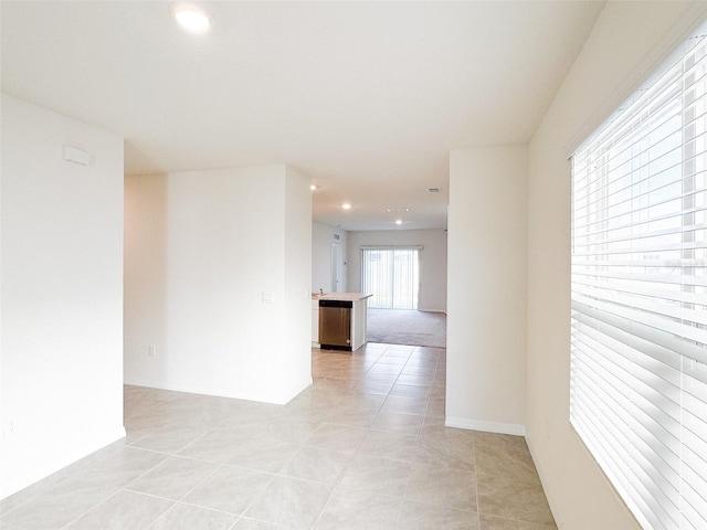 spare room featuring light tile patterned floors