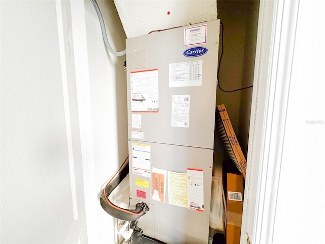 utility room with heating unit