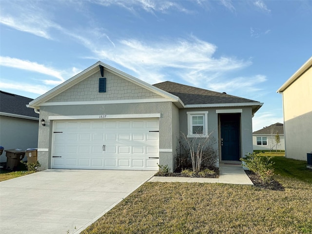 view of front facade featuring a garage and a front lawn