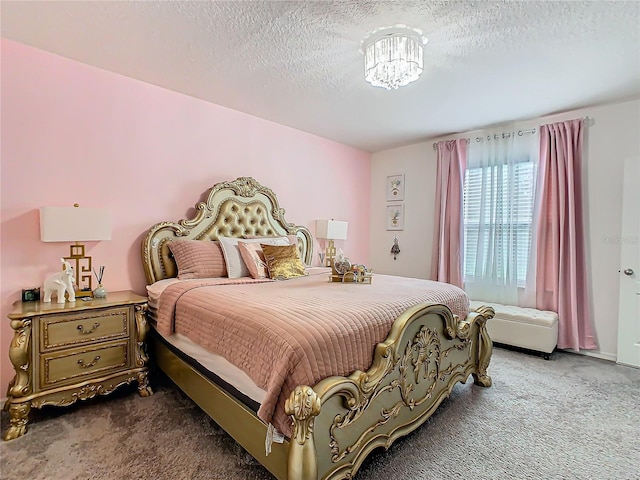 bedroom with carpet and a textured ceiling