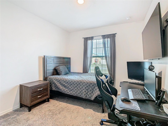 bedroom featuring light carpet