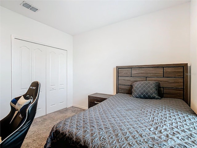 bedroom featuring carpet and a closet