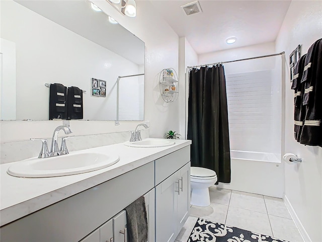 full bathroom with tile patterned flooring, vanity, toilet, and shower / bath combo with shower curtain