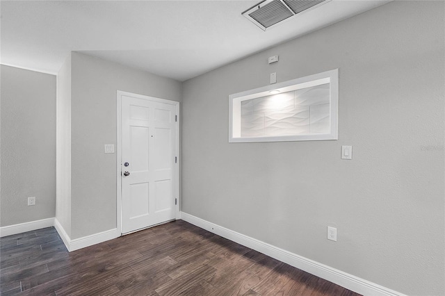 foyer entrance with dark hardwood / wood-style floors