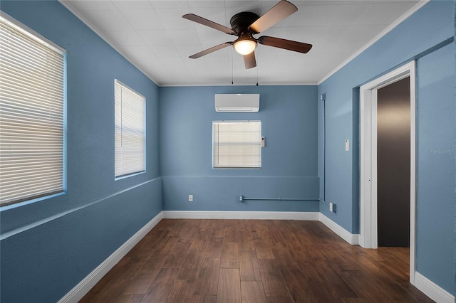 empty room featuring an AC wall unit, crown molding, ceiling fan, and dark wood-type flooring