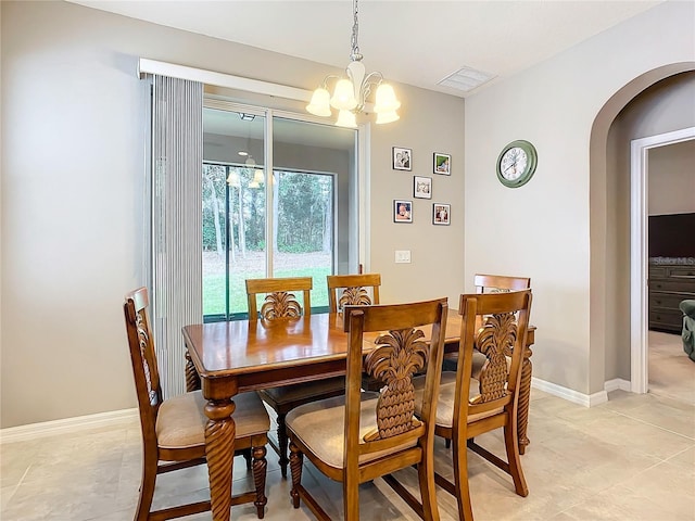 dining room with a notable chandelier