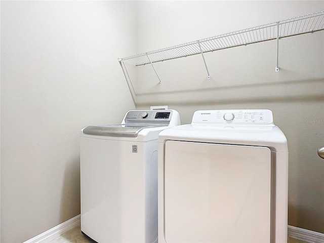 laundry room with washer and clothes dryer