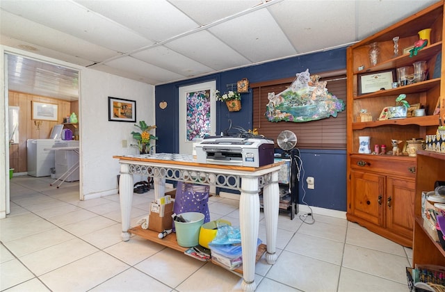 home office featuring a paneled ceiling and light tile patterned floors