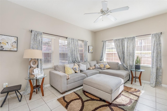 living room featuring ceiling fan and light tile patterned floors