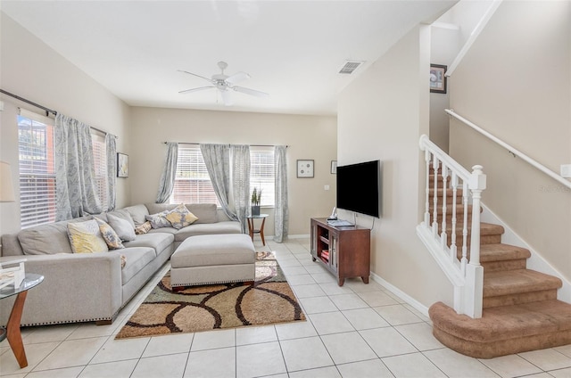 tiled living room featuring ceiling fan