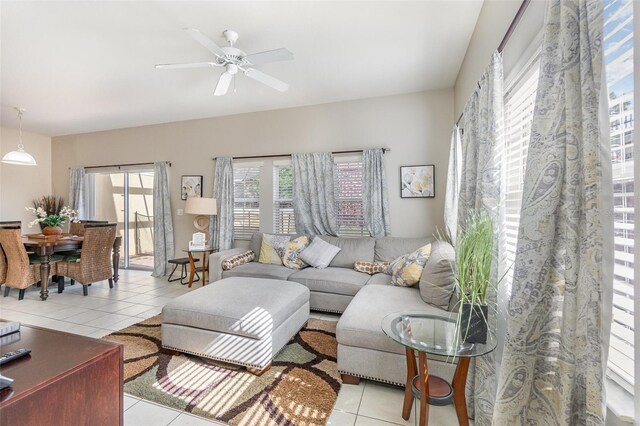 tiled living room featuring ceiling fan