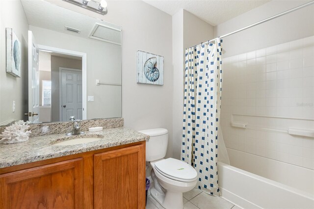 full bathroom featuring tile patterned flooring, vanity, toilet, and shower / tub combo with curtain