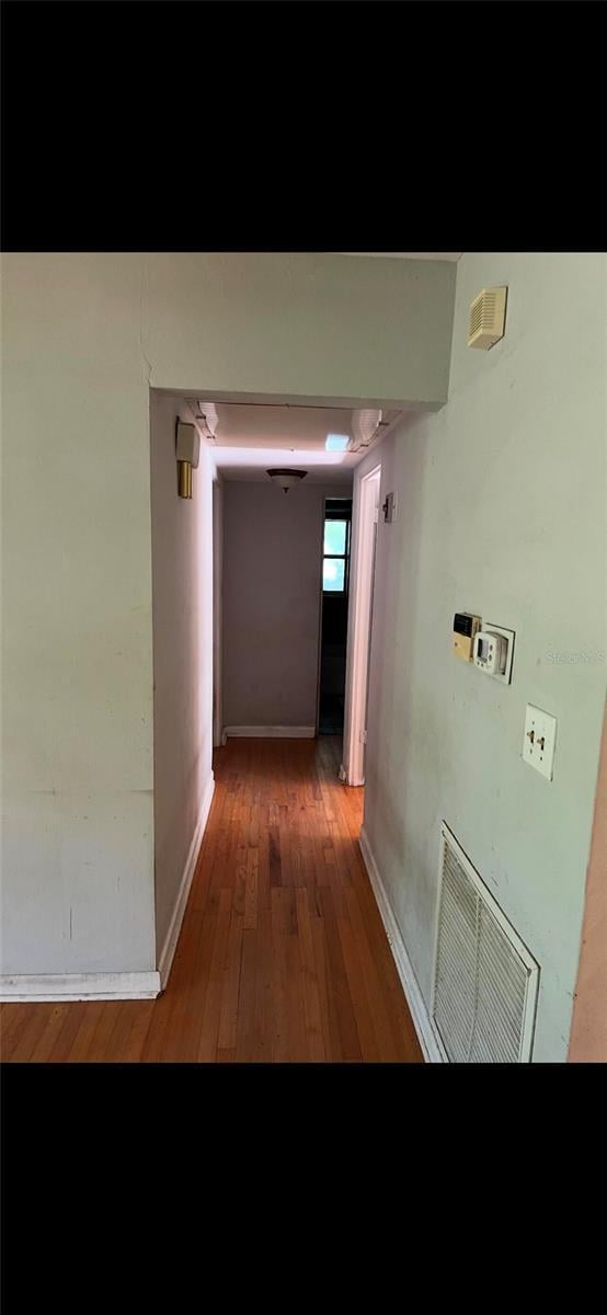 hallway featuring hardwood / wood-style floors