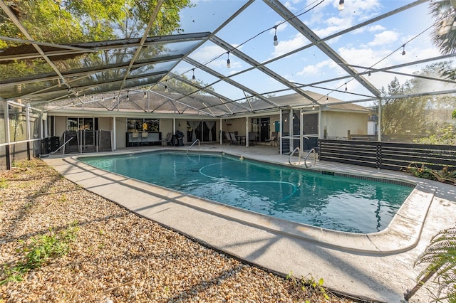 view of pool with a lanai and a patio area